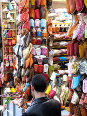 Fototapeta na wymiar Morocco. Typical moroccan shoes in a shoes shop
