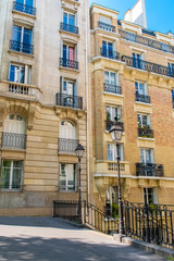 Fototapeta na wymiar Paris, romantic staircase in Montmartre, typical buildings and floor lamp 
