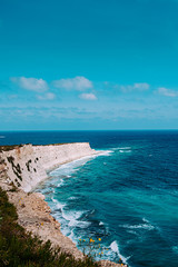 Fototapeta na wymiar Waves hitting the rocky coast of Malta.