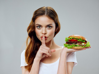young woman eating a sandwich