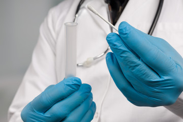 Close up of doctor's hand handling a smear test