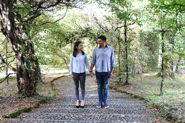 Boyfriend and Girlfriend in a Park - Holding Hands