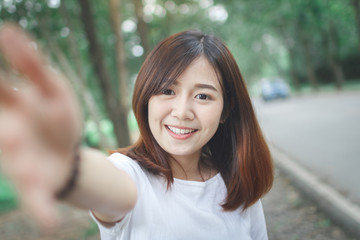 Happy woman check hand to front camera.