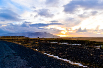 A photo of the Icelandic landscape at sunset during winter