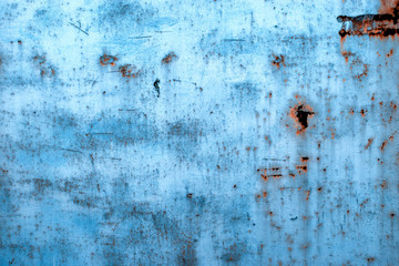 Old rusty metal wall. Rusty surface in blue.