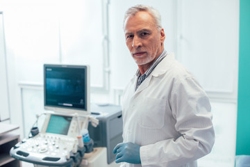Confident doctor in modern clinic with good equipment stock photo
