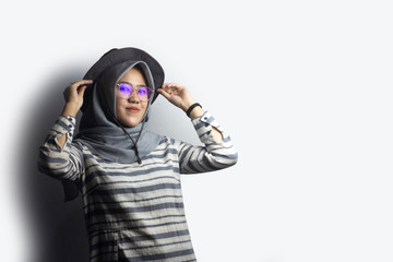 Potrait of 20s Young Woman with Hijab and using Glasses,Modern Moslem Concept,copy space ,selective focus