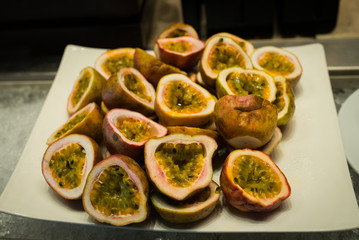 fresh passion fruit on a wooden board