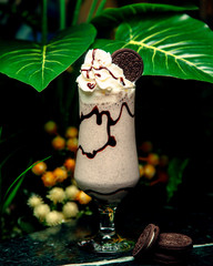 milkshake with whipped cream and oreo cookie on top