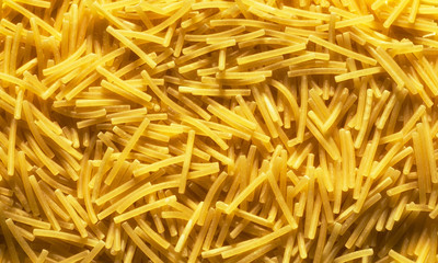 Dry vermicelli pasta background, close up