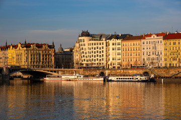 Obraz premium View on historical buildings of Prague and Vltava river
