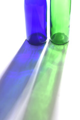 shadow of two bottles on white
