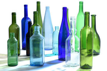 group of bottles scattered on a white background