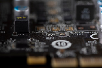 A fragment of the electronic board of the video card. Photographed close-up.