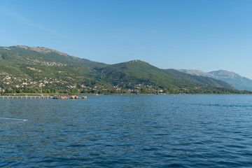 Fototapeta premium Ohrid, North Macedonia: lake and mountains and beautiful blue sky. August, 2019