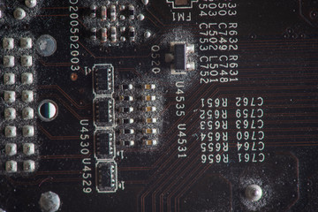 A fragment of the electronic board of the video card. Photographed close-up.
