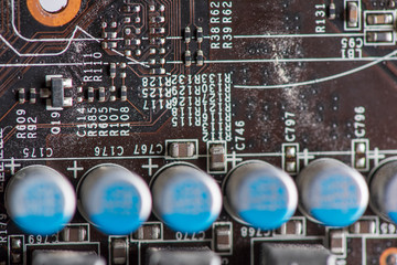 A fragment of the electronic board of the video card. Photographed close-up.