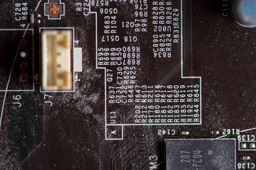 A fragment of the electronic board of the video card. Photographed close-up.