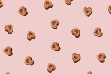 Pattern with pieces of sugar in the shape of hearts.