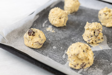 Raw crisp cookies prepared for baking on baking tray