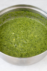 Cooked spinach in the pot. Healthy vegetables concept cooking