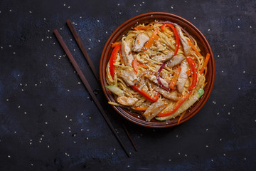 Wok with chicken in kimchi sauce and teriyaki udon noodles.