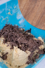 Cookie flour mixture in the bowl with black cooking chocolate