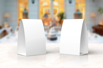 Blank paper menu table tents stands mockup on a marble stage or showroom for designers...