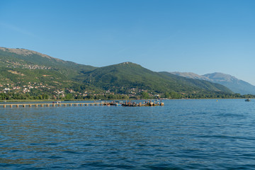Fototapeta premium Lake Ohrid in front of the big mountains in North Macedonia. August, 2019