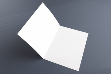 Opened bi-fold flyer brochure with geometric shadow from above overlay on grey background as...