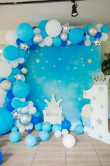 Photo zone with paper stars, balloons, large, voluminous paper figure 