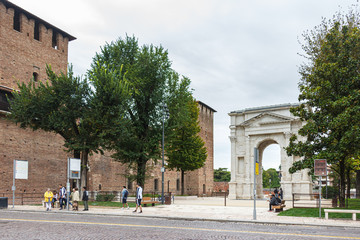 Fototapeta na wymiar Arco dei Gavi - massive, ancient white-marble arch dismantled by the French and reassembled in 1932 on Piazzetta Castelvecchio in Verona, Italy.
