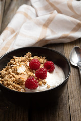  delicious breakfast with yogurt, granola and raspberries