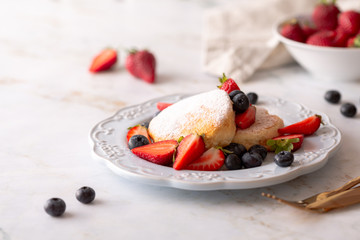 Fluffy pancakes for breakfast with berries