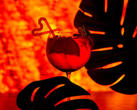 red breverage with lemon inside