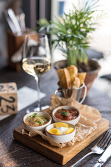Roasted Aubergine Dip, Tomato Basil Sauce and Cream Cheese with Fruit. Assorted Appetizers and Wine