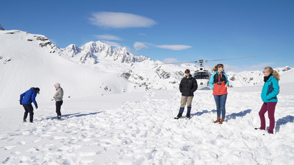Snow covered Franz Josef and Fox Glaciers on a sunny day near Waiau on the South Island of New...