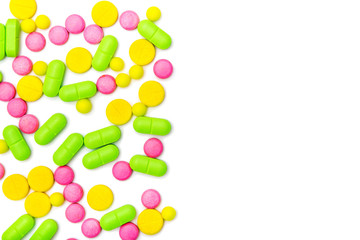 ndful of tablets and pills in hand isolated on white