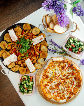 sadj and pizza with salad