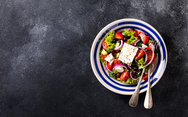 Greek salad of fresh vegetables, olives and feta. Traditional Mediterranean food.