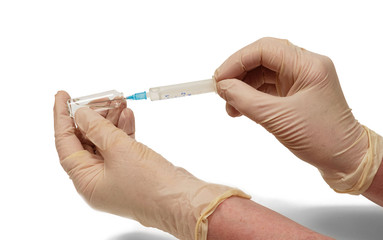 Sick nurse hands in rubber gloves are  withdrawing medicine on white background, isolated