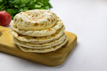 pita breads on a white background