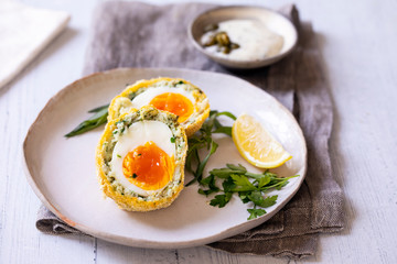 Scotch eggs wrapped with smoked haddock and cod