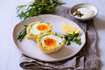 Scotch eggs wrapped with smoked haddock and cod