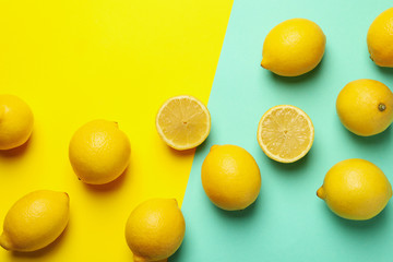 Fresh lemons on two tone background, top view. Ripe fruit
