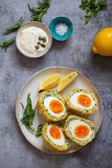 Scotch eggs wrapped with smoked haddock and cod