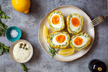 Scotch eggs wrapped with smoked haddock and cod