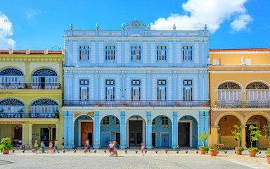 Havana Cuba View of Plaza Vieja colored houses with a sunny blue sky.
