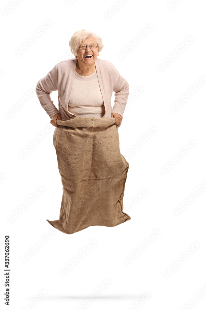 Sticker happy elderly woman jumping with a sack and laughing