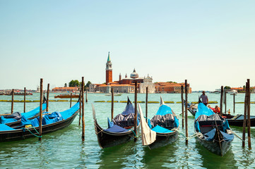 Fototapeta na wymiar The view of gandolas on Grand canal in Venice, Italy